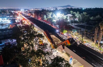 MEXICO CITY, MEXICO - MAY 03: An aerial view of the scene after an elevated section of metro track in Mexico City, carrying train cars with passengers, collapsed onto a busy road on May 03, 2021 in Mexico City, Mexico. The Line 12 accident happened as the metro train was traveling between Olivos and Tezonco Metro stations, reportedly killing at least 20 people and injuring further 70. (Photo by Hector Vivas/Getty Images)