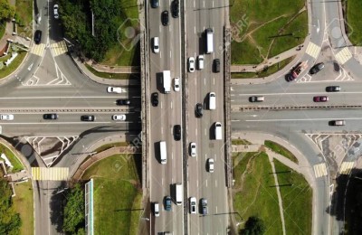 Top view of a city intersection with bus, cars, truck. Traffic at daytime, roadcross in the megapolis.